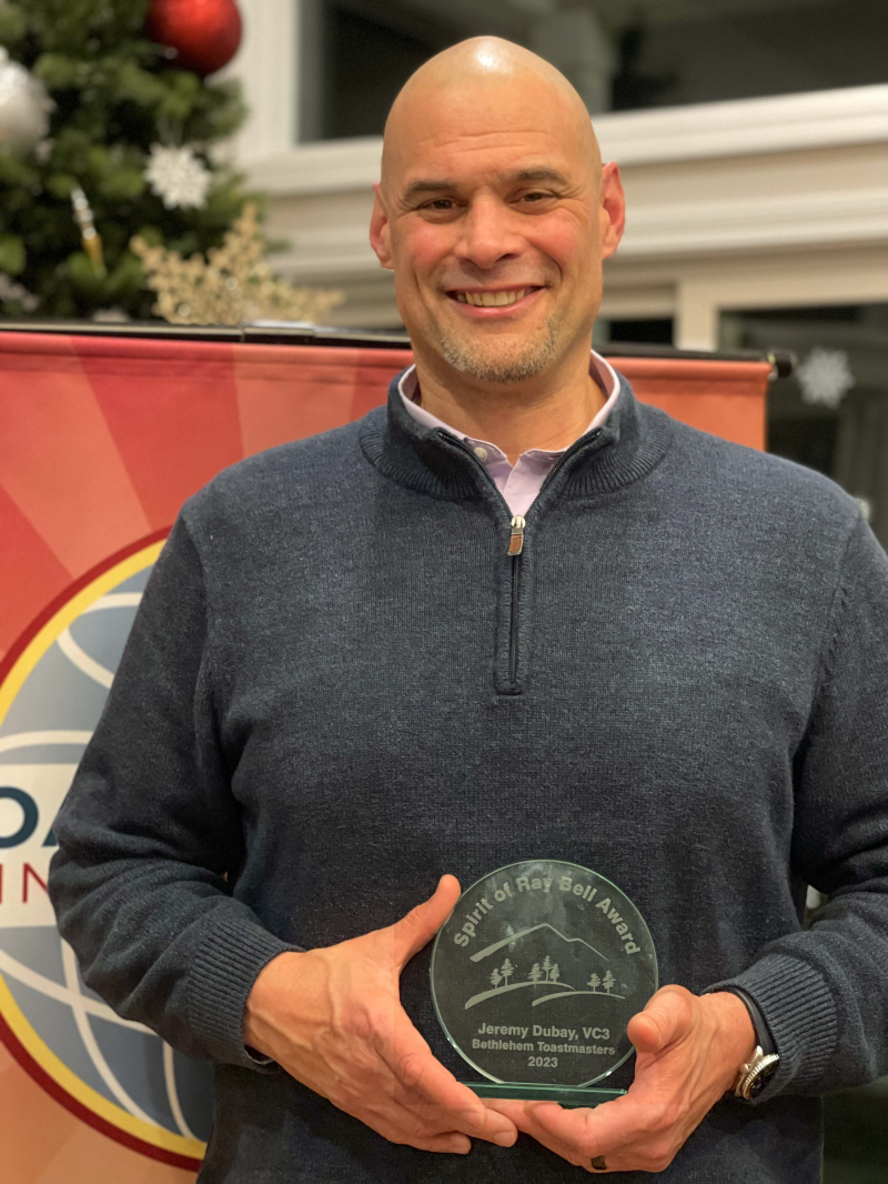 Jeremy Dubay displaying his 2023 Ray Bell Award